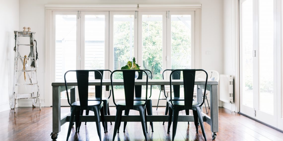 Gorgeous vintage styled light bright dining room with bifold doors