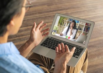 Man video calling his psychologist to have a vistual session while in quarantine during the coronavirus