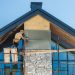Construction,Worker,Installing,Stone,Veneer,On,A,Modern,Home