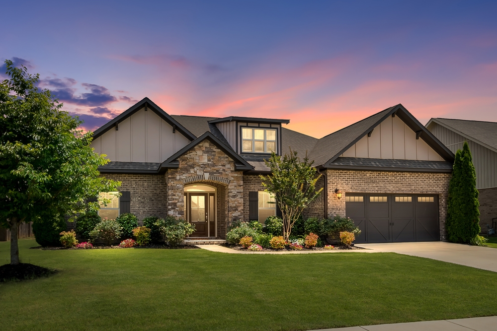 Contemporary,Home,Exterior,With,Colorful,Sunset.,Green,Grass,,Brick,And