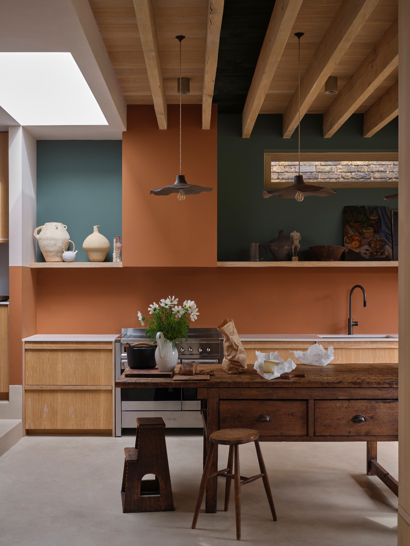 A kitchen with a table and stools