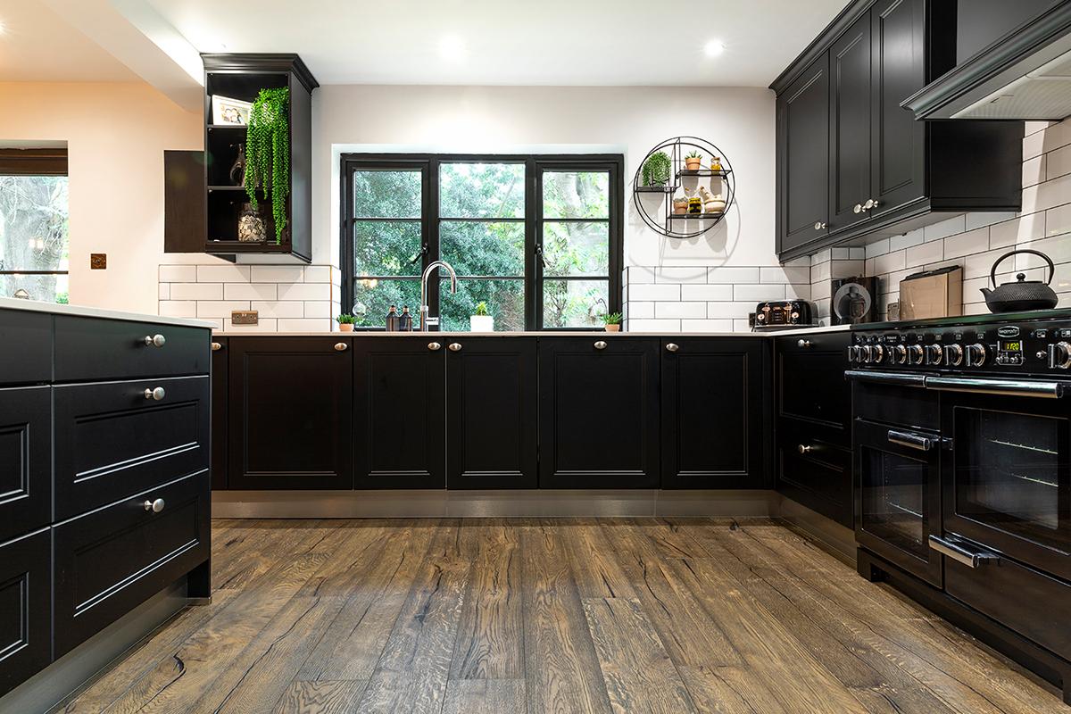 A kitchen with black cabinets

Description automatically generated with medium confidence