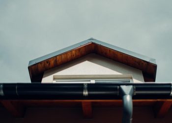 brown wooden roof under white sky during daytime