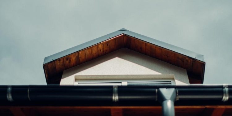 brown wooden roof under white sky during daytime