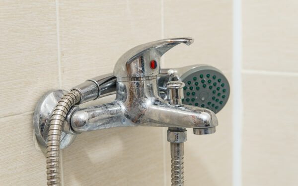 dirty calcified shower mixer tap