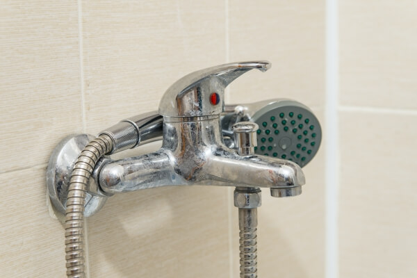 dirty calcified shower mixer tap