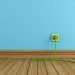Energy efficiency concept with green electric plugs on blue wall - rendering -