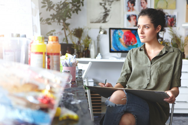 Macintosh HD:Users:vincentcolistro:Downloads:portrait-thoughtful-beautiful-young-brunette-female-artist-wearing-khaki-shirt-ripped-jeans-sitting-chair-home-workshop_273609-343.jpg