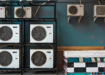 white and black box fan on brown wooden shelf