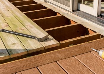 Repair and replacement of an old wooden deck or patio with modern composite plastic material