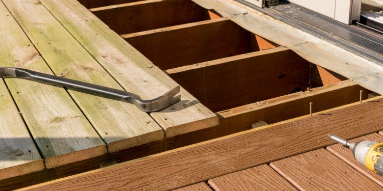 Repair and replacement of an old wooden deck or patio with modern composite plastic material