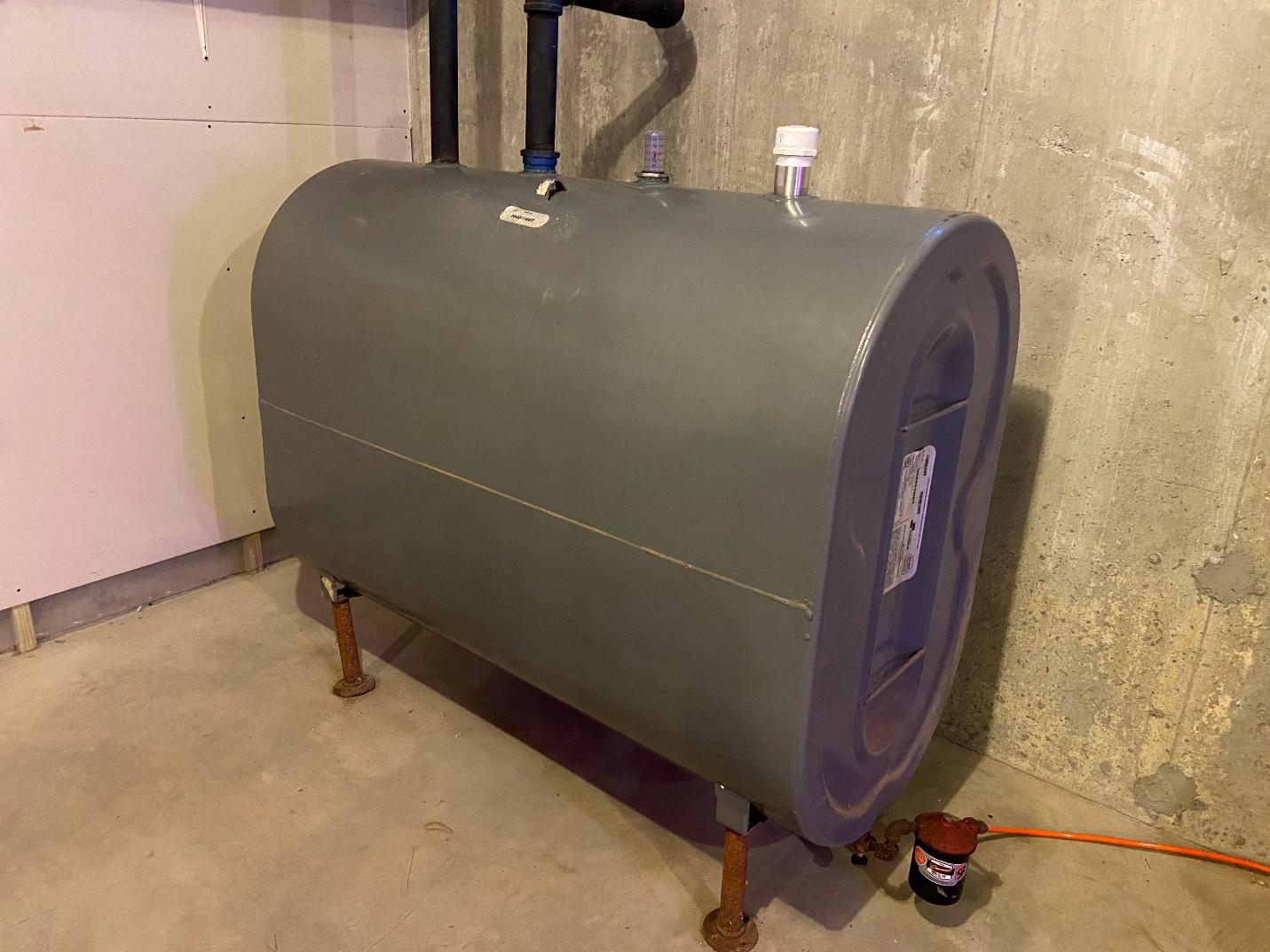 A dry basement is the best place for a home heating oil tank to be stored. Since moisture is the enemy of a steel tank like this, ensuring it stays dry is the best thing you can do to extend the life of your oil tank.